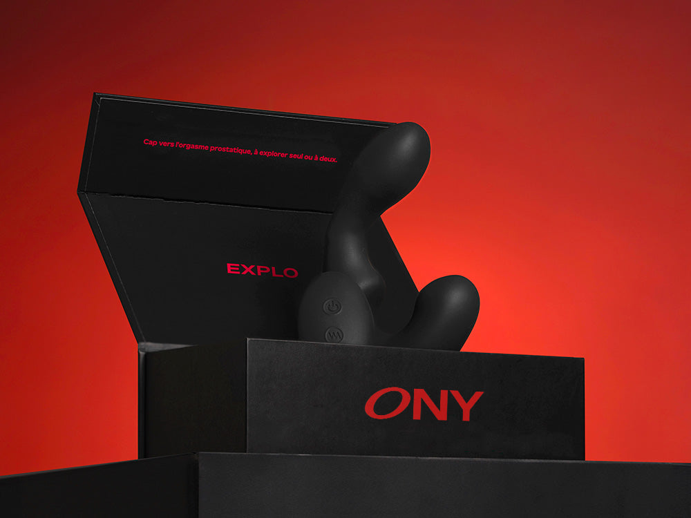 The prostate massager Explo placed in its black packaging
